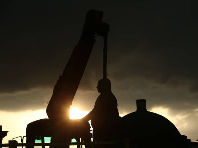 Workers take down a statue of slave owner Robert Milligan at West India Quay, east London as Labour councils across England and Wales will begin reviewing monuments and statues in their towns and cities, after a protest saw anti-racism campaigners tear down a statue of a slave trader in Bristol. Picture by Yui Mok/PA Wire