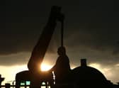 Workers take down a statue of slave owner Robert Milligan at West India Quay, east London as Labour councils across England and Wales will begin reviewing monuments and statues in their towns and cities, after a protest saw anti-racism campaigners tear down a statue of a slave trader in Bristol. Picture by Yui Mok/PA Wire