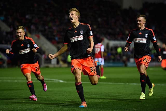 Dan Burn of Fulham celebrates scoring his sides third goal during the Sky bet Championship match between Rotherham United and Fulham at The New York Stadium on October 21, 2014 in Rotherham, England.  (Photo by Laurence Griffiths/Getty Images)