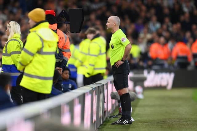 Referee Paul Tierney checks a Newcastle United goal on the VAR screen during the Premier League match between Nottingham Forest and Newcastle United at City Ground on March 17, 2023 in Nottingham, England. (Photo by Shaun Botterill/Getty Images)