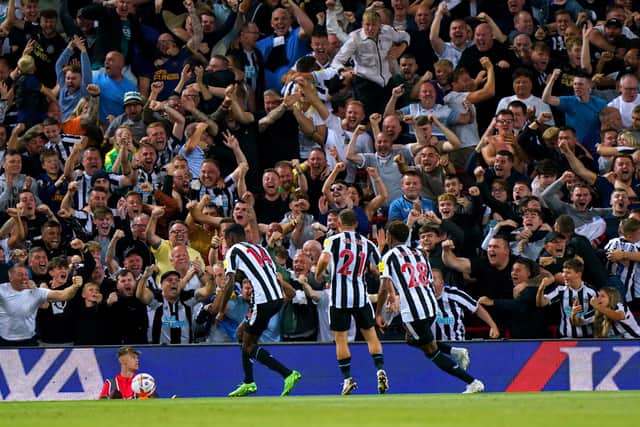Newcastle United's Alexander Isak celebrates scoring at Anfield.