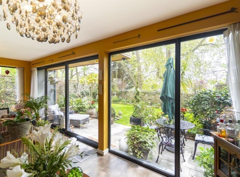 Sliding doors open up to the garden.
