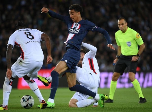 Paris Saint-Germain's French forward Hugo Ekitike (C) and Nice's Dutch midfielder Pablo Rosario fight for the ball during the French L1 football match between Paris Saint-Germain (PSG) and OGC Nice at The Parc des Princes Stadium in Paris on October 1, 2022. (Photo by FRANCK FIFE / AFP) (Photo by FRANCK FIFE/AFP via Getty Images)
