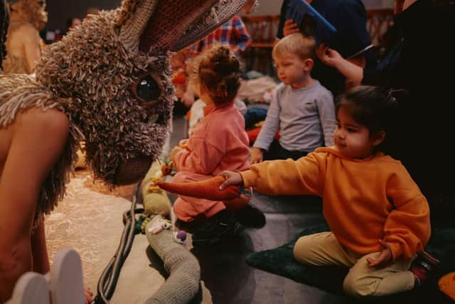 Feeding knitted carrots to the rabbits at balletLORENT's The Velveteen Rabbit