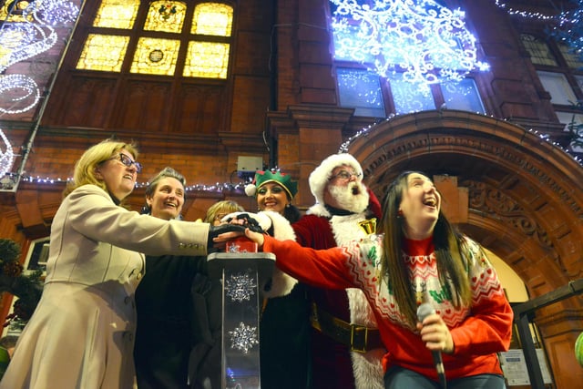 Jarrow MP Kate Osborne (second left) gives Santa a hanChristmas