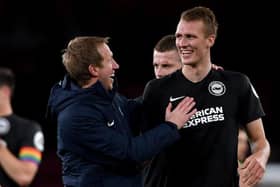 Head coach Graham Potter of Brighton celebrates with Dan Burn of Brighton after winning the Premier League match between Arsenal FC and Brighton & Hove Albion at Emirates Stadium on December 05, 2019 in London, United Kingdom. (Photo by Mike Hewitt/Getty Images)