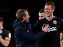 Head coach Graham Potter of Brighton celebrates with Dan Burn of Brighton after winning the Premier League match between Arsenal FC and Brighton & Hove Albion at Emirates Stadium on December 05, 2019 in London, United Kingdom. (Photo by Mike Hewitt/Getty Images)