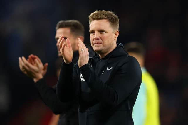 Newcastle United head coach Eddie Howe applauds fans at the Vitality Stadium.