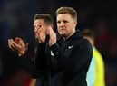 Newcastle United head coach Eddie Howe applauds fans at the Vitality Stadium.