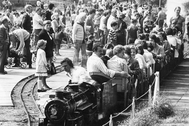 Back to 1980 and August Bank Holiday crowds at the South Marine Park. The steam engine takes another load of passengers for a trip around the lake.