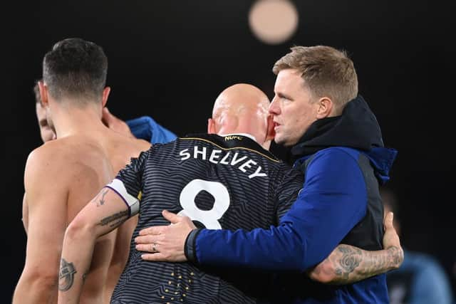 Jonjo Shelvey is congratulated by head coach Eddie Howe.