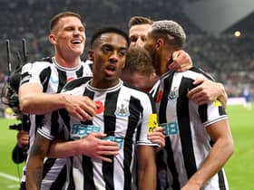 Joe Willock of Newcastle United celebrates after scoring their team's first goal during the Premier League match between Newcastle United and Chelsea FC at St. James Park on November 12, 2022 in Newcastle upon Tyne, England. (Photo by Stu Forster/Getty Images)