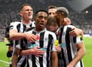 Joe Willock of Newcastle United celebrates after scoring their team's first goal during the Premier League match between Newcastle United and Chelsea FC at St. James Park on November 12, 2022 in Newcastle upon Tyne, England. (Photo by Stu Forster/Getty Images)