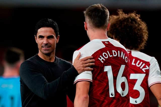 Mikel Arteta greets Rob Holding.
