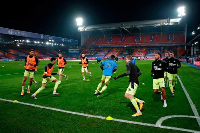 Newcastle's players warm up.