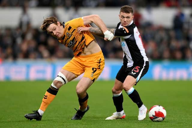 Kieran Trippier of Newcastle United challenges Joe Ironside of Cambridge United during the Emirates FA Cup Third Round match between Newcastle United and Cambridge United at St James' Park on January 08, 2022 in Newcastle upon Tyne, England. (Photo by Stu Forster/Getty Images)