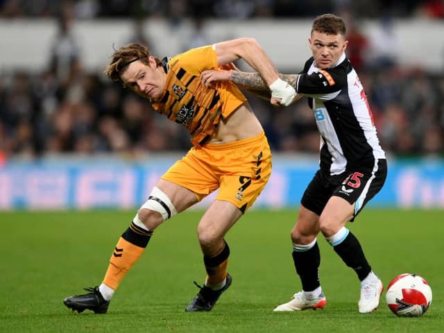 Kieran Trippier of Newcastle United challenges Joe Ironside of Cambridge United during the Emirates FA Cup Third Round match between Newcastle United and Cambridge United at St James' Park on January 08, 2022 in Newcastle upon Tyne, England. (Photo by Stu Forster/Getty Images)