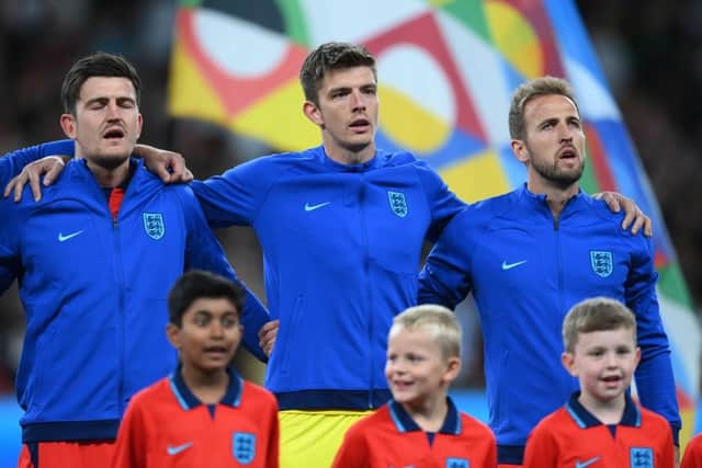 Harry Maguire, Nick Pope and Harry Kane of England stand for the national anthem prior to the UEFA Nations League League A Group 3 match between England and Germany at Wembley Stadium on September 26, 2022 in London, England. (Photo by Shaun Botterill/Getty Images)