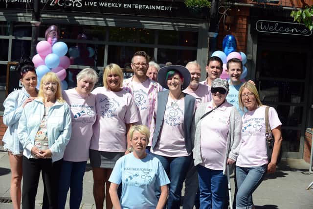 Staff and customers at Ziggys Bar pay tribute on Pink and Blue Day last year.