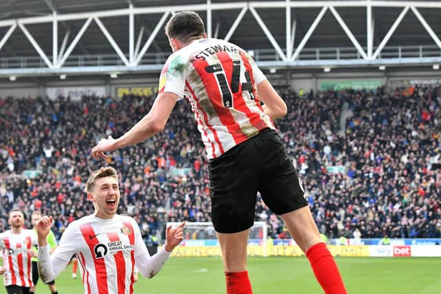 Ross Stewart celebrates his second goal at the DW Stadium