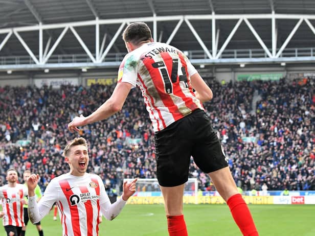 Ross Stewart celebrates his second goal at the DW Stadium
