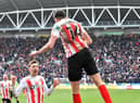 Ross Stewart celebrates his second goal at the DW Stadium
