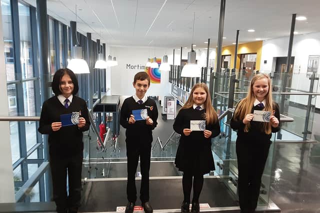 Students from Mortimer Community College proudly presenting their postcards ready to send to NHS workers.