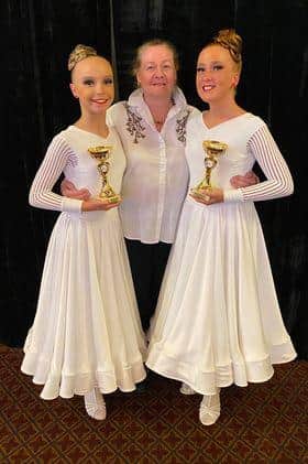 Pippa Smith and Molly Barnfather with their dance teacher Wendy Hatton.