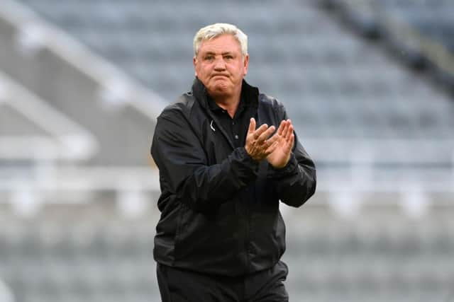 Steve Bruce applauds fans in midweek.