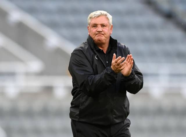 Steve Bruce applauds fans in midweek.