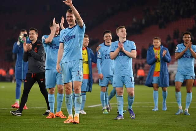 Dan Burn and his team-mates celebrate Newcastle United's win over Southampton.