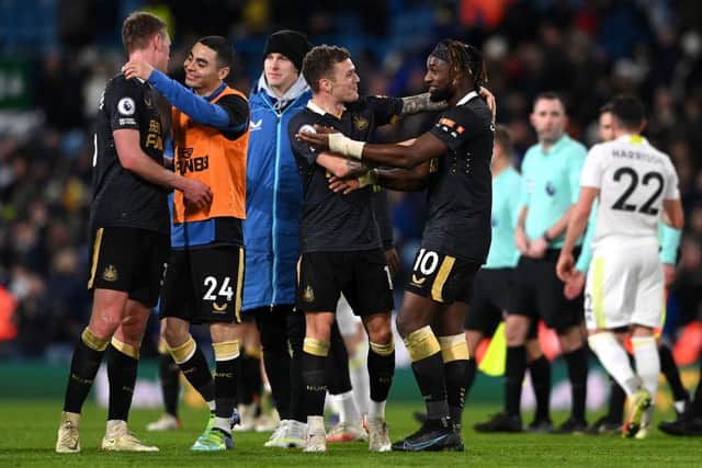 Kieran Trippier embraces Allan Saint-Maximin of Newcastle United after their sides victory during the Premier League match between Leeds United and Newcastle United at Elland Road on January 22, 2022 in Leeds, England. (Photo by Stu Forster/Getty Images)
