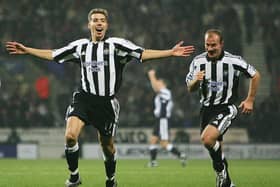 Darren Ambrose of Newcastle celebrates his equalising goal with Alan Shearer during the FA Barclays Premiership match between Bolton Wanderers and Newcastle at The Reebok Stadium on October 31, 2004 in Bolton, England.  (Photo by Laurence Griffiths/Getty Images)