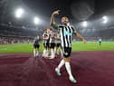 Newcastle United striker Callum Wilson celebrates scoring his second goal.