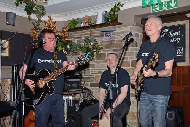Michael McNally (right) performing with The Derelicts.