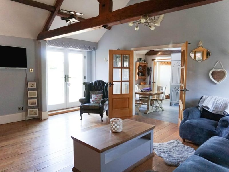 Lounge.family room with internal doors leading to the breakfast kitchen
