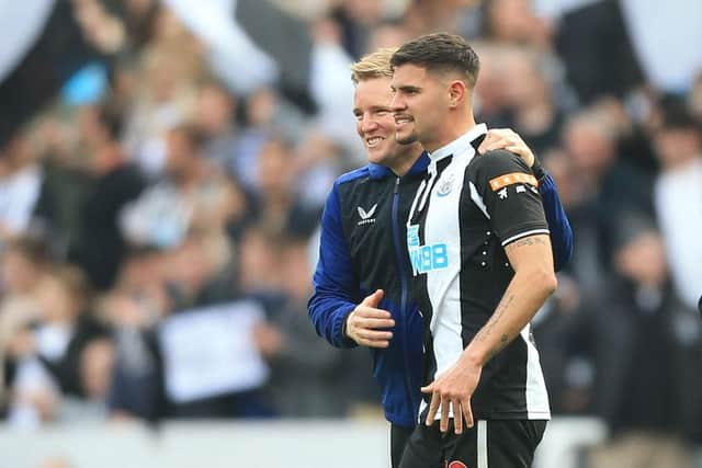 Newcastle United head coach Eddie Howe congratulates Bruno Guimaraes.