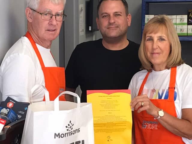 Greer and Linda Morrison, volunteers at Horsley Hill community shop with  Mark Patterson, community champion at Morrisons South Shields