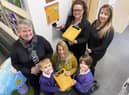 Hebburn Lakes primary school pupils Coen Isherwood and Felicia Ekroth present a Defibrillator to Judith Reay headteacher at Sue Hedley Nursery. Looking on are Hebburn Lakes parents Sarah Summerhill (left) and Michelle Butler (right, with Amanda Moody the Headteacher at Hebburn Lakes who is holding a Defibrillator that has been installed at the school.