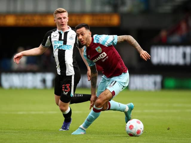 Dwight McNeil of Burnley on the ball whilst under pressure from Matt Targett of Newcastle United (Photo by Jan Kruger/Getty Images)