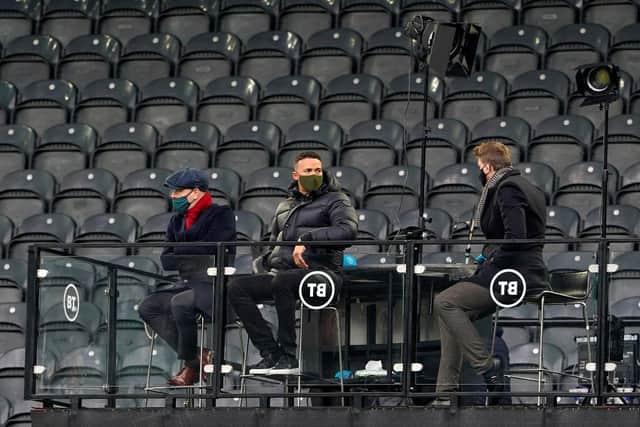 Joe Cole, Jermaine Jenas and Jake Humphrey are seen sitting in the BT Studios box (Photo by Owen Humphreys - Pool/Getty Images)