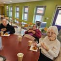 Residents Pat Dempsey, Lillian Smythe and Anna Mason from HC-One’s Redesdale Court Care Home enjoying a cup of tea and berry muffin in their local café