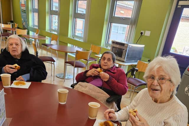 Residents Pat Dempsey, Lillian Smythe and Anna Mason from HC-One’s Redesdale Court Care Home enjoying a cup of tea and berry muffin in their local café