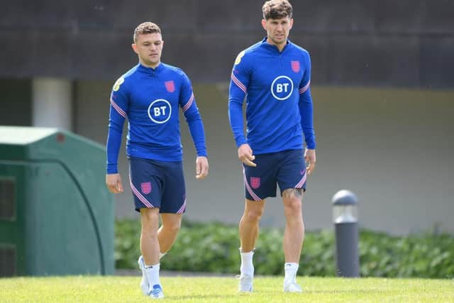 Kieran Trippier and John Stones of England look on during an England Training Session at St Georges Park on June 03, 2022 in Burton-upon-Trent, England. (Photo by Shaun Botterill/Getty Images)