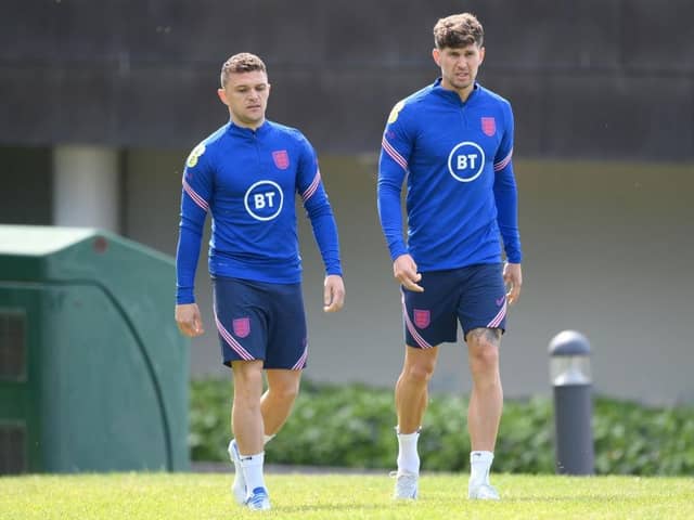 Kieran Trippier and John Stones of England look on during an England Training Session at St Georges Park on June 03, 2022 in Burton-upon-Trent, England. (Photo by Shaun Botterill/Getty Images)