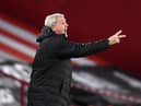 Newcastle United's English head coach Steve Bruce shouts instructions to his players from the touchline during the English Premier League football match between Sheffield United and Newcastle United at Bramall Lane in Sheffield, northern England on January 12, 2021.