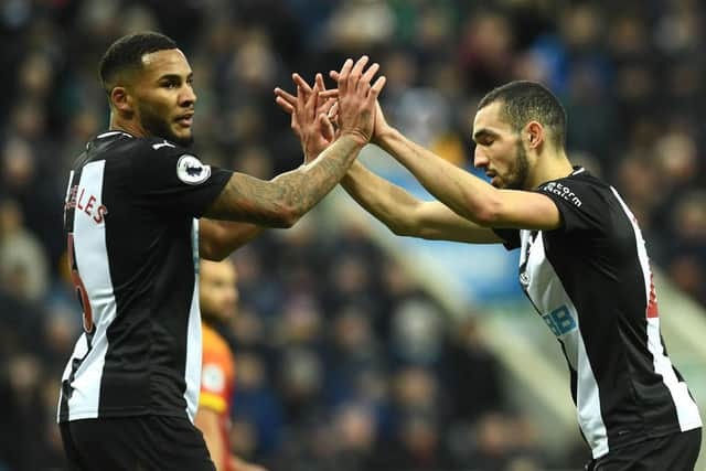 NEWCASTLE UPON TYNE, ENGLAND - FEBRUARY 01: Jamaal Lascelles and Nabil Bentaleb of Newcastle United embrace during the Premier League match between Newcastle United and Norwich City at St. James Park on February 01, 2020 in Newcastle upon Tyne, United Kingdom. (Photo by Mark Runnacles/Getty Images)