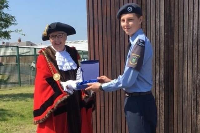 The Mayor presents a plaque to Cadet Kai Wisniewski