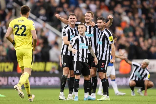 Nick Pope joins in with the celebrations as team mates Sven Botman, Kieran Trippier, Dan Burn and Fabian Schar celebrates their side's win after the final whistle of the Premier League match between Newcastle United and Everton FC at St. James Park on October 19, 2022 in Newcastle upon Tyne, England. (Photo by George Wood/Getty Images)