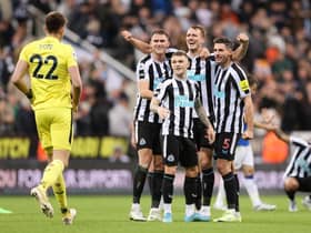 Nick Pope joins in with the celebrations as team mates Sven Botman, Kieran Trippier, Dan Burn and Fabian Schar celebrates their side's win after the final whistle of the Premier League match between Newcastle United and Everton FC at St. James Park on October 19, 2022 in Newcastle upon Tyne, England. (Photo by George Wood/Getty Images)